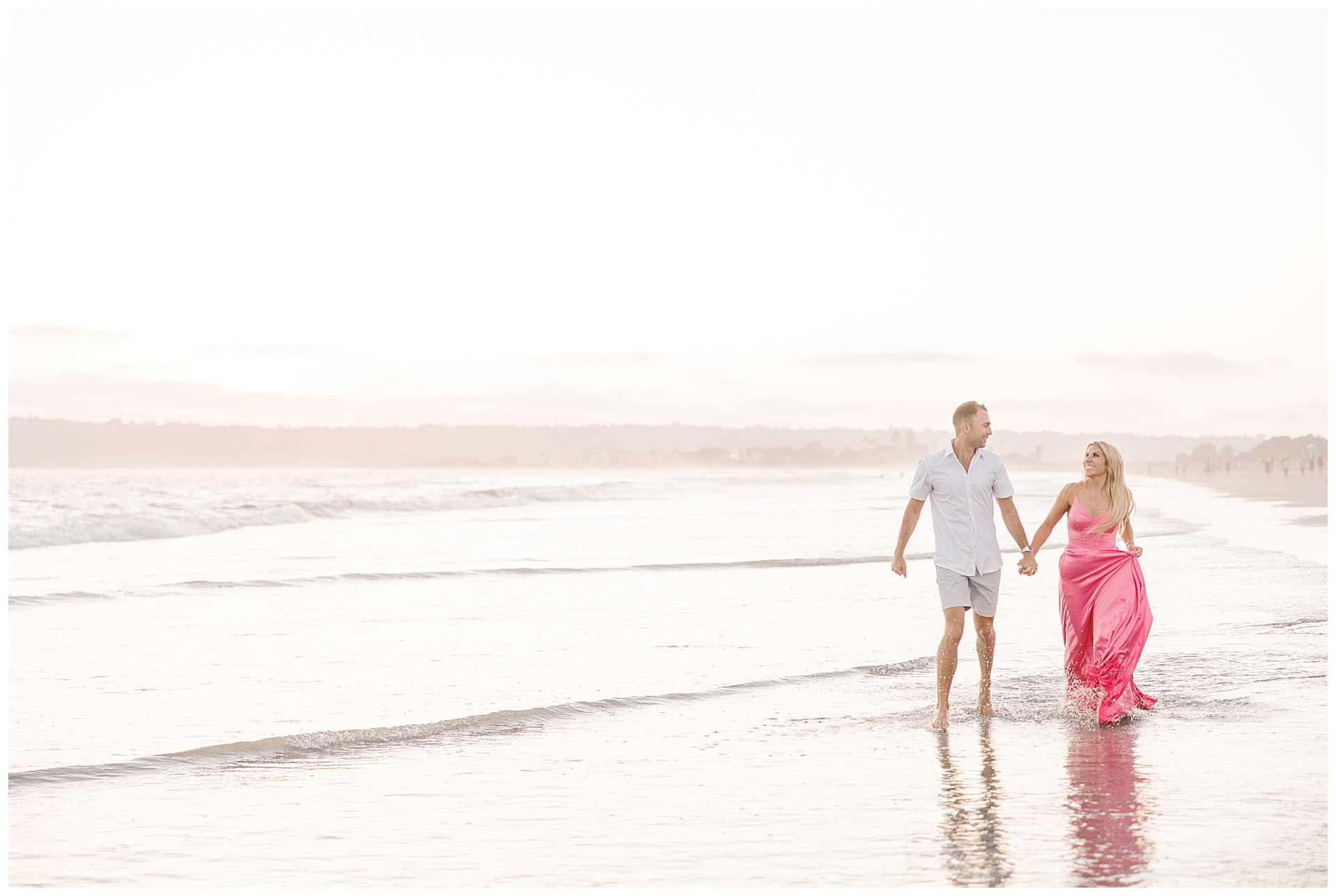 Engagement Couple walking in the ocean at Coronado Beach