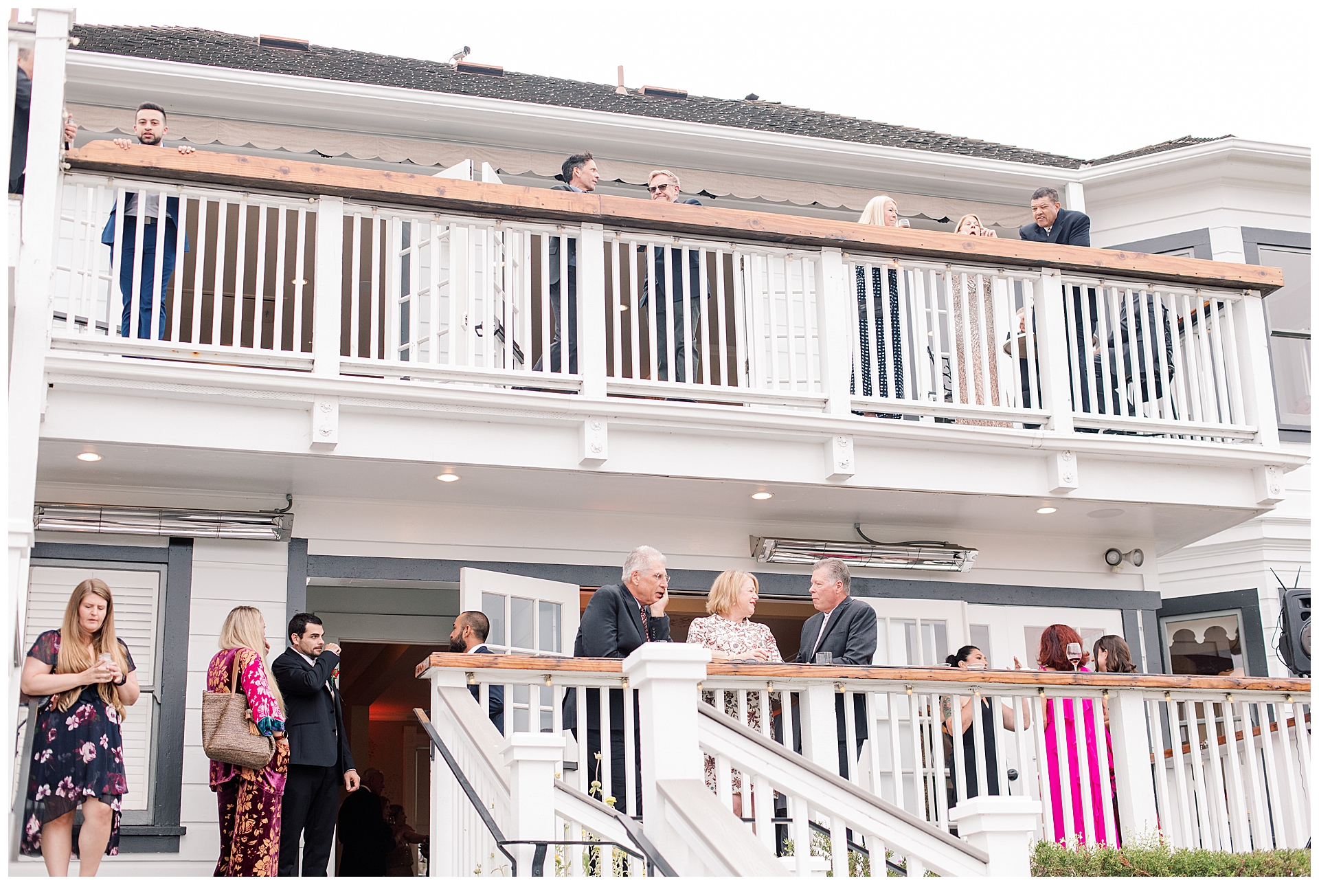 Guests mingling during cocktail hour at the Perry House in Monterey.