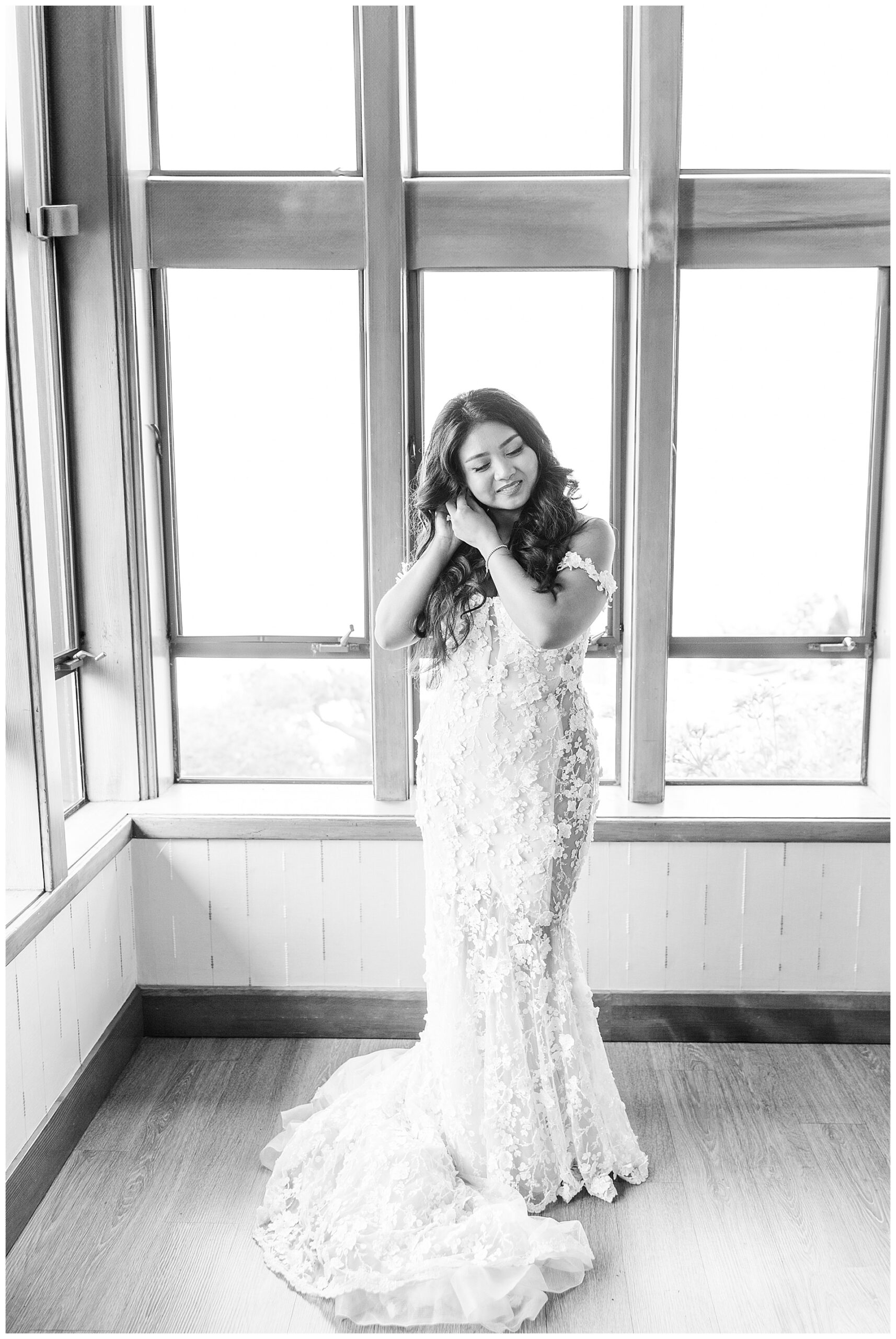 Bride putting on her earings for her Carmel Highlands wedding.